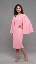 Woman wearing a pink dress with cape sleeves