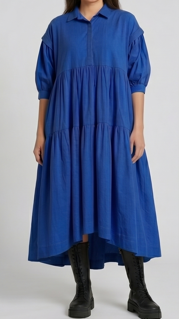 Woman wearing a blue dress on a white background