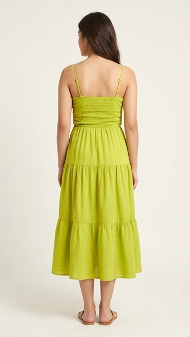 Woman wearing a green dress on a white background