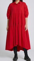 Woman wearing a red dress with a white background