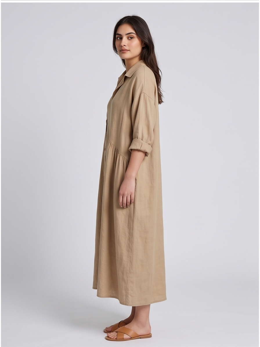 Woman wearing a beige dress on a white background