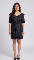 Woman wearing a black dress with a white background
