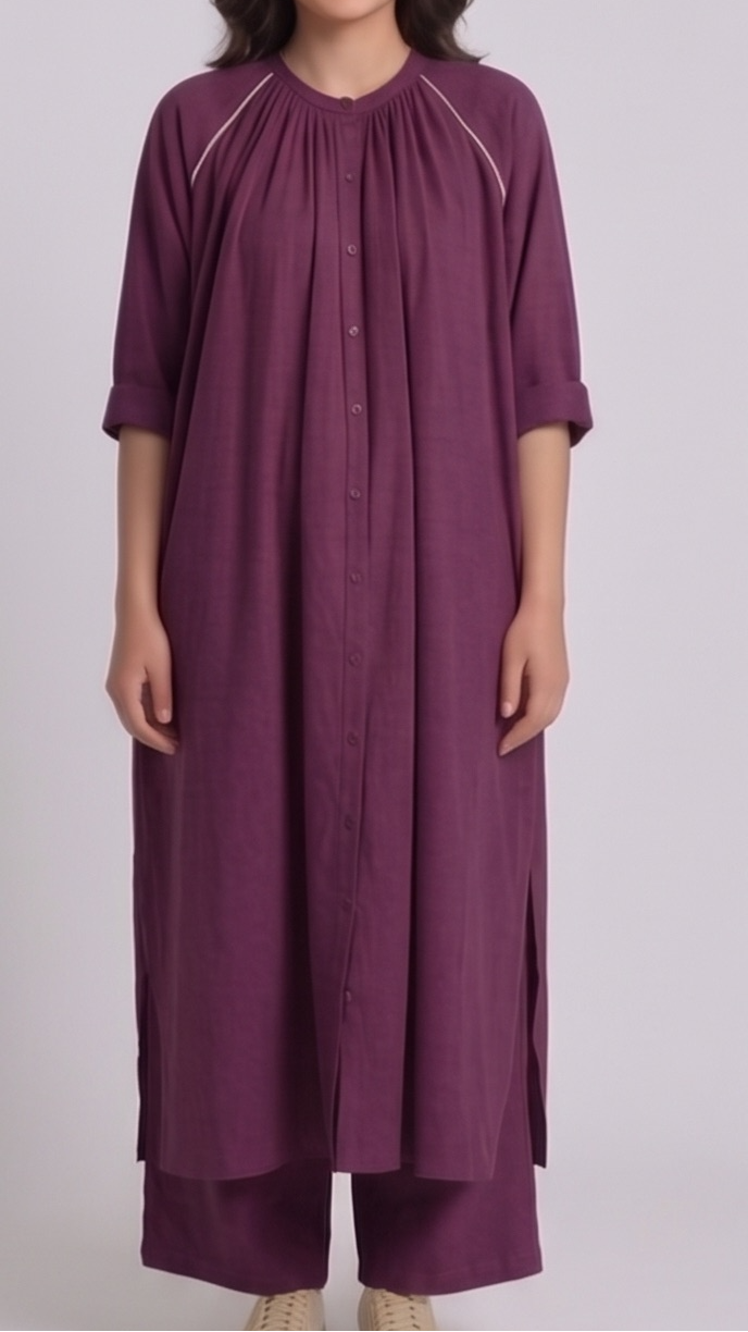 Woman wearing a long purple dress with a plain background