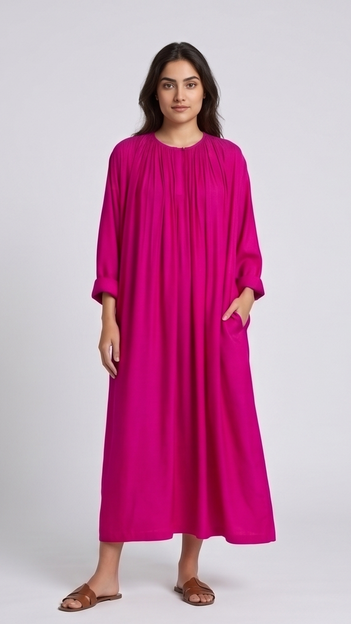 Woman wearing a bright hot-pink dress on a white background