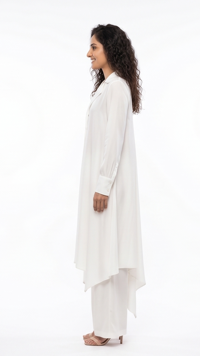 Woman wearing a white long-sleeve top and pants on a white background