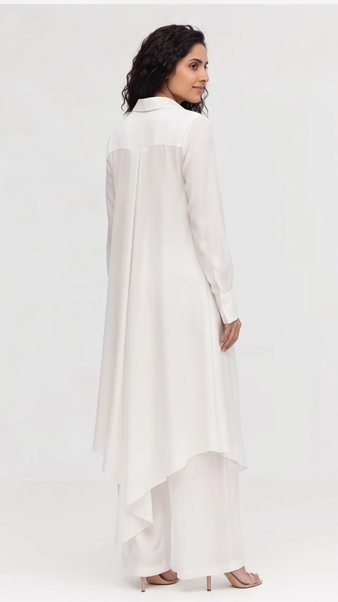 Woman wearing a white long-sleeve shirt on a white background